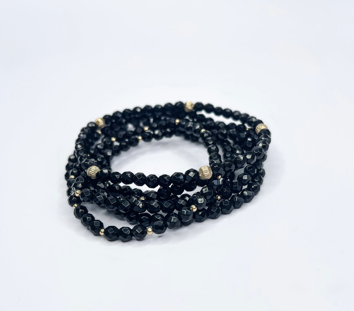 Black onyx, gold spacers beads bracelet